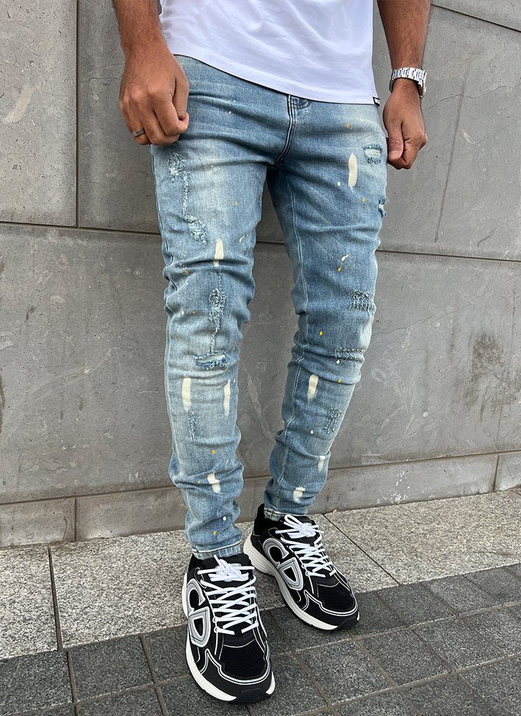 Distressed Paint Jeans – Blau