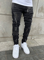 Distressed Paint Jeans – Schwarz