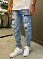 Reparierte Lackjeans – Hellblau